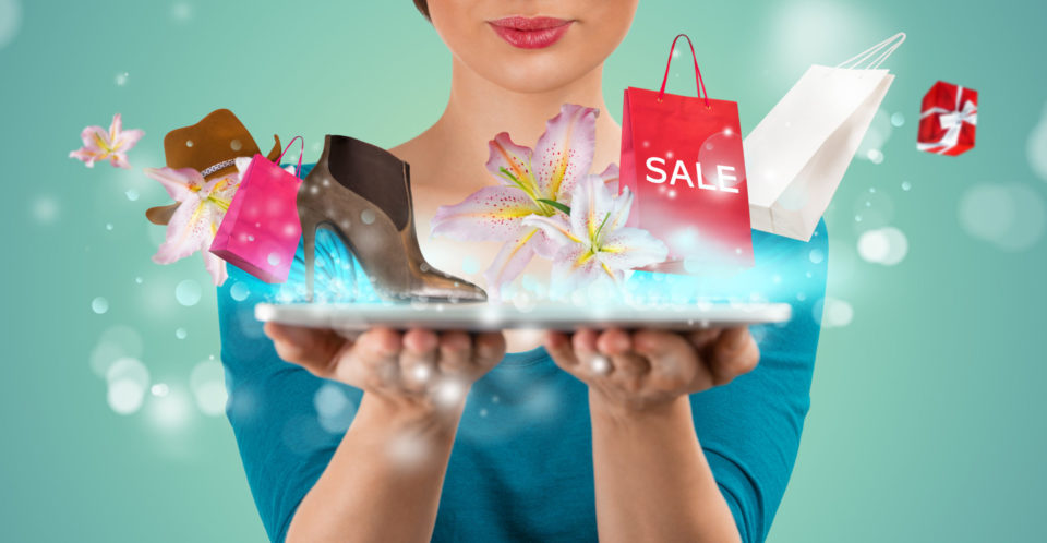 woman holding a tablet like a tray with shoes, hats, shopping bags, gifts and flowers hovering above it with magic sparkles.